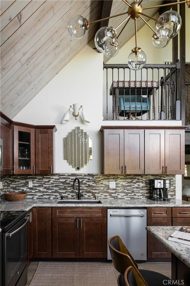 832 Rhine Rd, Lake Arrowhead, CA 92352 - kitchen with stainless steel dishwasher, black electric range, high vaulted ceiling, decorative backsplash, and light stone counters