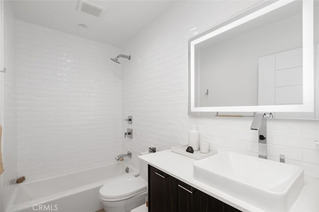 2329 Vineyard Ave, Los Angeles, CA 90016 - full bath featuring shower / bathtub combination, vanity, decorative backsplash, and tile walls