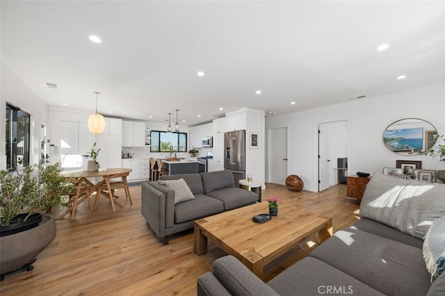 2329 Vineyard Ave, Los Angeles, CA 90016 - living room featuring light wood-style flooring and recessed lighting