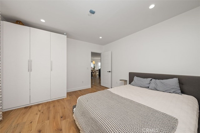 2329 Vineyard Ave, Los Angeles, CA 90016 - bedroom with light wood finished floors and recessed lighting