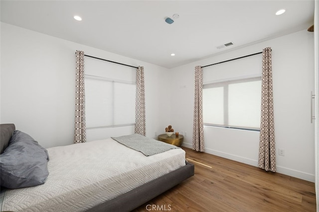 2329 Vineyard Ave, Los Angeles, CA 90016 - bedroom with wood finished floors and recessed lighting