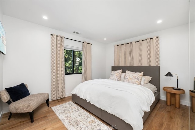 2329 Vineyard Ave, Los Angeles, CA 90016 - bedroom with light wood-style floors and recessed lighting