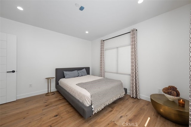 2329 Vineyard Ave, Los Angeles, CA 90016 - bedroom with light wood-style floors and recessed lighting