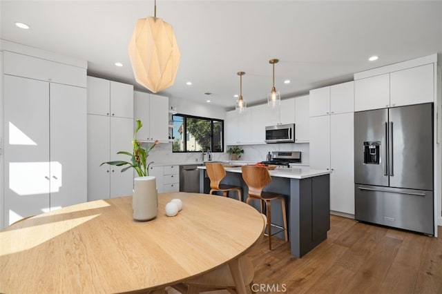 2329 Vineyard Ave, Los Angeles, CA 90016 - dining area featuring wood finished floors and recessed lighting