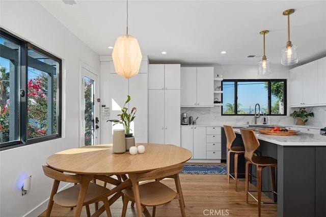2329 Vineyard Ave, Los Angeles, CA 90016 - dining space featuring light wood finished floors, healthy amount of natural light, and recessed lighting