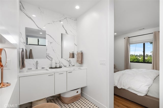 2329 Vineyard Ave, Los Angeles, CA 90016 - ensuite bathroom with double vanity and recessed lighting