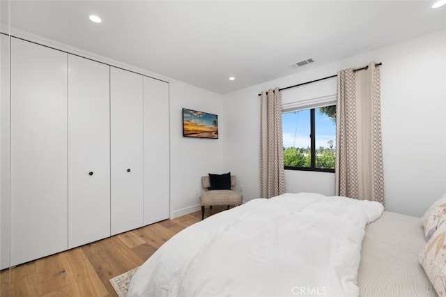 2329 Vineyard Ave, Los Angeles, CA 90016 - bedroom featuring light wood finished floors, a closet, and recessed lighting