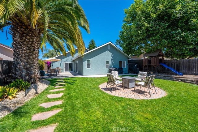 109 W Chestnut St, Nipomo, CA 93444 - fenced backyard with a patio area and a playground