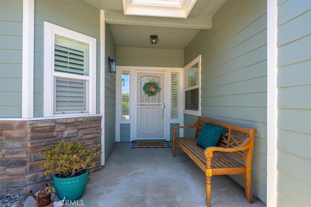 109 W Chestnut St, Nipomo, CA 93444 - doorway to property featuring stone siding and a porch
