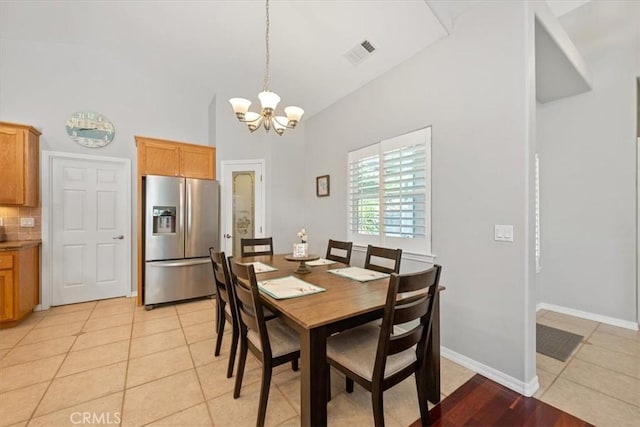109 W Chestnut St, Nipomo, CA 93444 - dining area with a chandelier, light tile patterned floors, and high vaulted ceiling