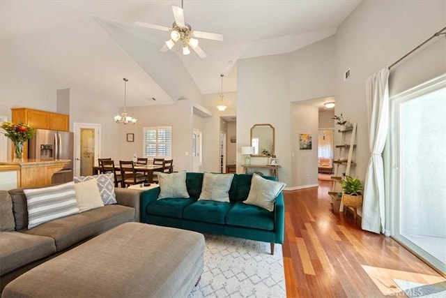 109 W Chestnut St, Nipomo, CA 93444 - living area with high vaulted ceiling, light wood finished floors, a chandelier, and ceiling fan