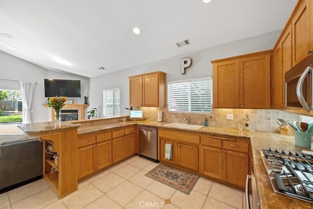 109 W Chestnut St, Nipomo, CA 93444 - kitchen featuring stainless steel appliances, lofted ceiling, plenty of natural light, decorative backsplash, and a peninsula