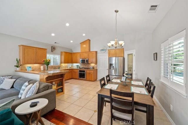109 W Chestnut St, Nipomo, CA 93444 - dining space featuring a chandelier, healthy amount of natural light, light tile patterned flooring, and high vaulted ceiling