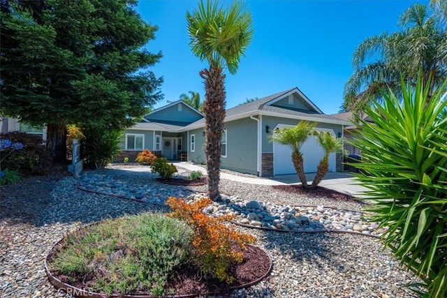 109 W Chestnut St, Nipomo, CA 93444 - ranch-style home featuring stone siding, a garage, and concrete driveway