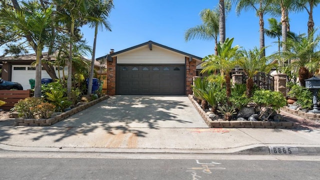 8865 Highsmith Ln, San Diego, CA 92119 - ranch-style home featuring concrete driveway, a garage, and brick siding