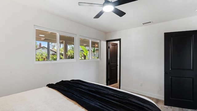 8865 Highsmith Ln, San Diego, CA 92119 - bedroom featuring a ceiling fan and wood finished floors
