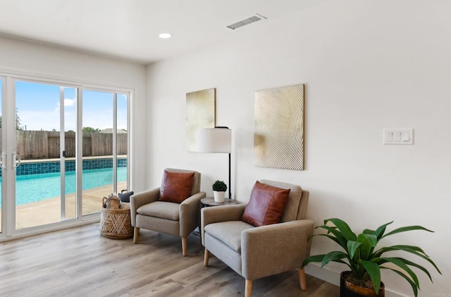 8865 Highsmith Ln, San Diego, CA 92119 - living area featuring wood finished floors and recessed lighting