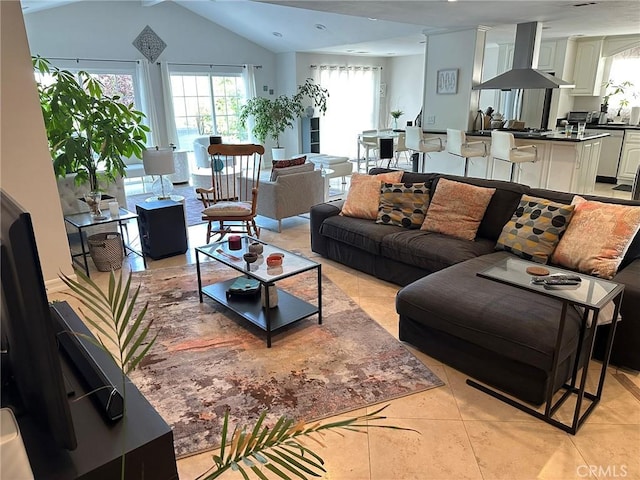 24017 Sylvan St, Woodland Hills, CA 91367 - living room featuring light tile patterned floors, plenty of natural light, and vaulted ceiling