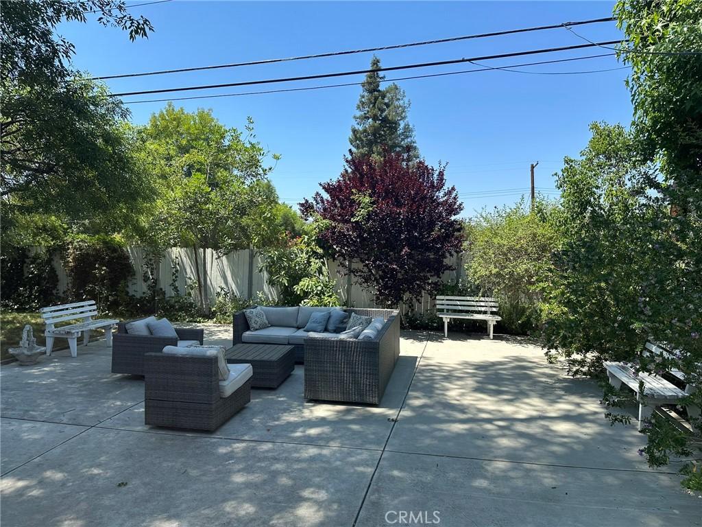 24017 Sylvan St, Woodland Hills, CA 91367 - fenced backyard featuring an outdoor hangout area and a patio