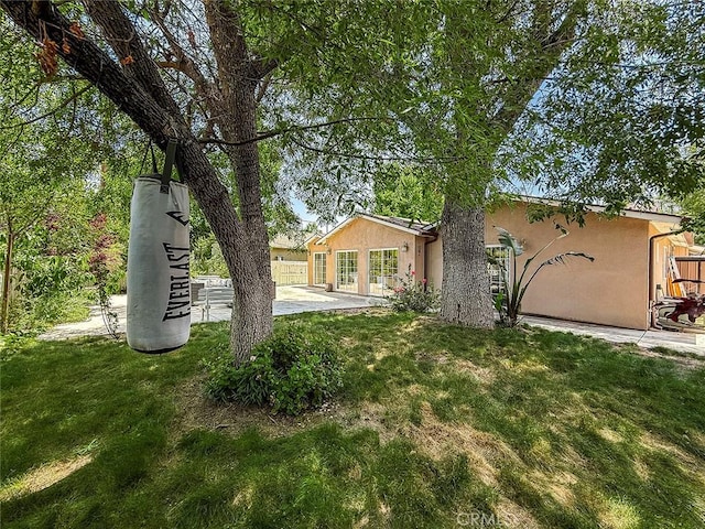 24017 Sylvan St, Woodland Hills, CA 91367 - rear view of property featuring stucco siding and a patio area