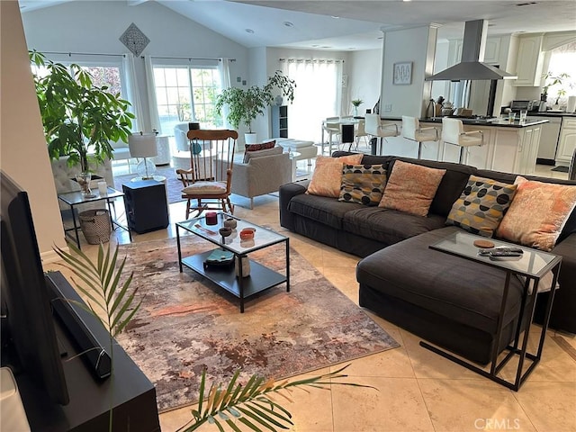 24017 Sylvan St, Woodland Hills, CA 91367 - living area featuring light tile patterned flooring, healthy amount of natural light, and lofted ceiling