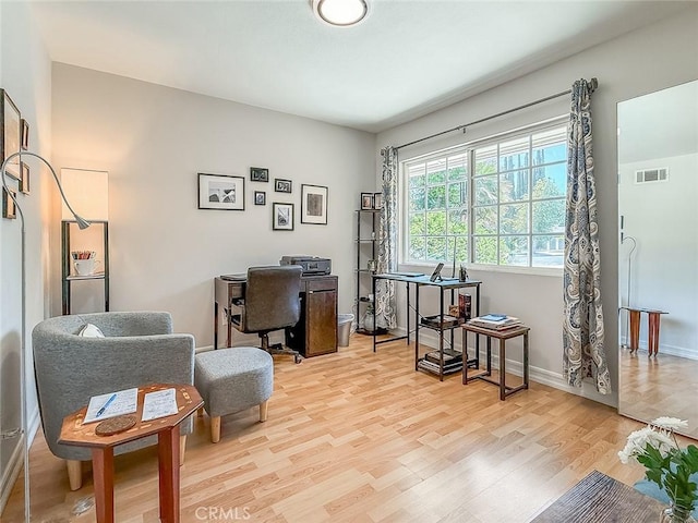 24017 Sylvan St, Woodland Hills, CA 91367 - home office with light wood-type flooring and baseboards
