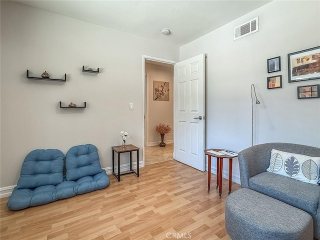 24017 Sylvan St, Woodland Hills, CA 91367 - living area with baseboards and light wood-style flooring