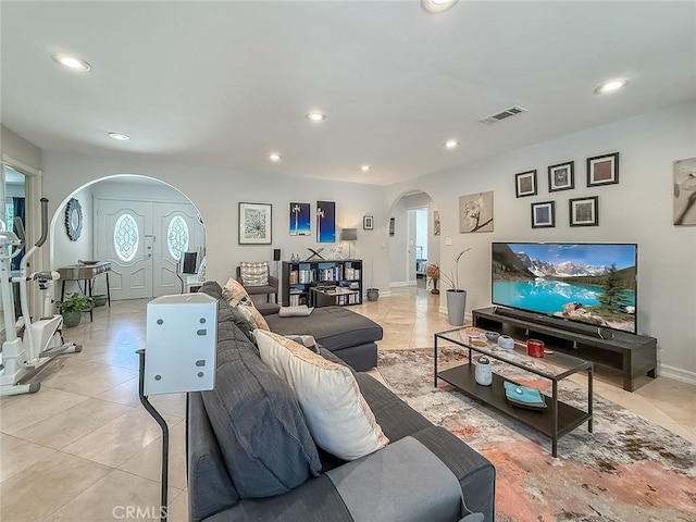 24017 Sylvan St, Woodland Hills, CA 91367 - living room with arched walkways, recessed lighting, and light tile patterned floors