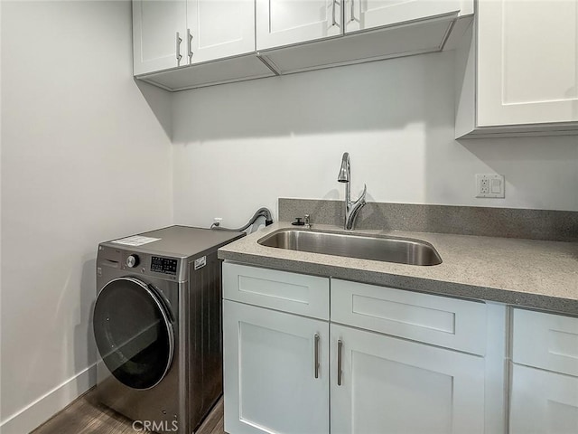24017 Sylvan St, Woodland Hills, CA 91367 - washroom with washer / clothes dryer, cabinet space, and wood finished floors