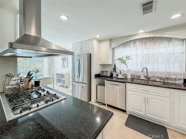24017 Sylvan St, Woodland Hills, CA 91367 - kitchen featuring wall chimney range hood, stainless steel appliances, dark stone countertops, recessed lighting, and white cabinets