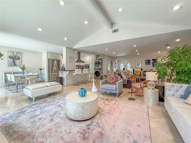 24017 Sylvan St, Woodland Hills, CA 91367 - living area with estacked washer and dryer, recessed lighting, and light tile patterned flooring