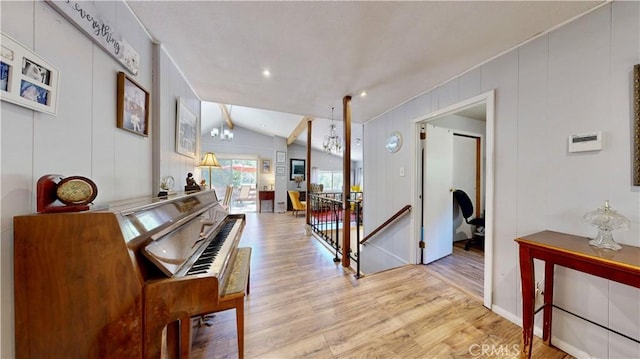 23728 Manzanita Dr, Crestline, CA 92325 - hall featuring lofted ceiling, light wood-style flooring, and an upstairs landing