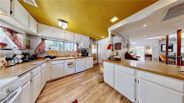23728 Manzanita Dr, Crestline, CA 92325 - kitchen with white appliances, light wood-style floors, white cabinetry, and light countertops
