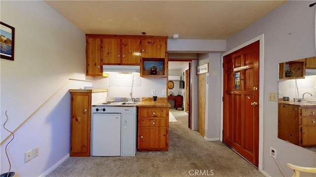 23728 Manzanita Dr, Crestline, CA 92325 - kitchen with under cabinet range hood, light colored carpet, and brown cabinetry