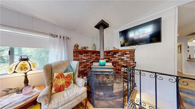 23728 Manzanita Dr, Crestline, CA 92325 - living area with a wood stove and wood finished floors