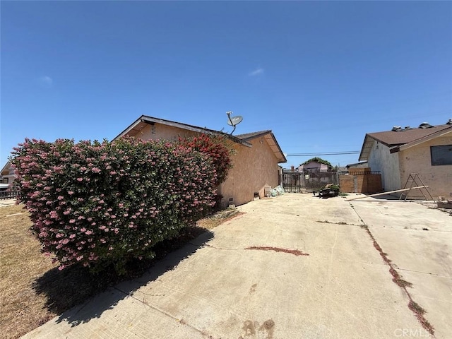 2073 Sandalwood Dr, Santa Maria, CA 93455 - view of side of home featuring concrete driveway and stucco siding