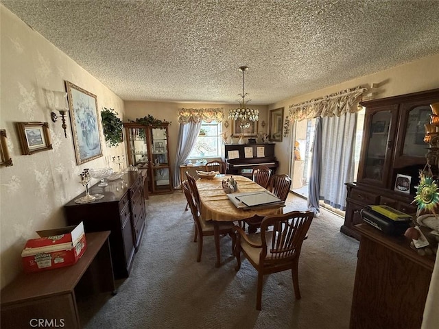 2073 Sandalwood Dr, Santa Maria, CA 93455 - dining space with a textured ceiling, carpet flooring, and a chandelier