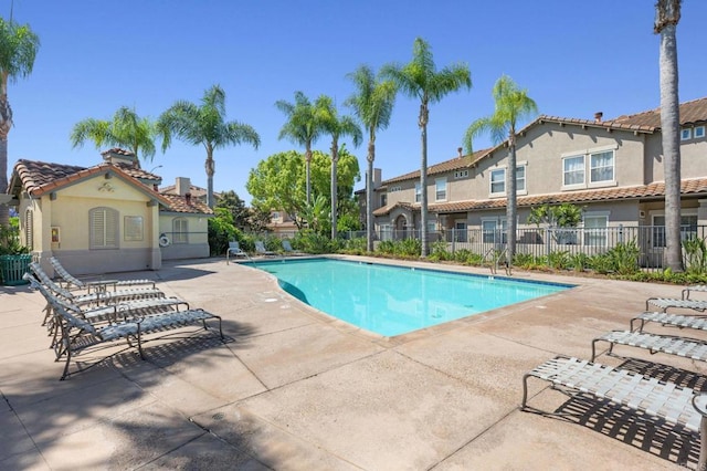 6104 Citracado Cir, Carlsbad, CA 92009 - community pool featuring a patio area and a residential view