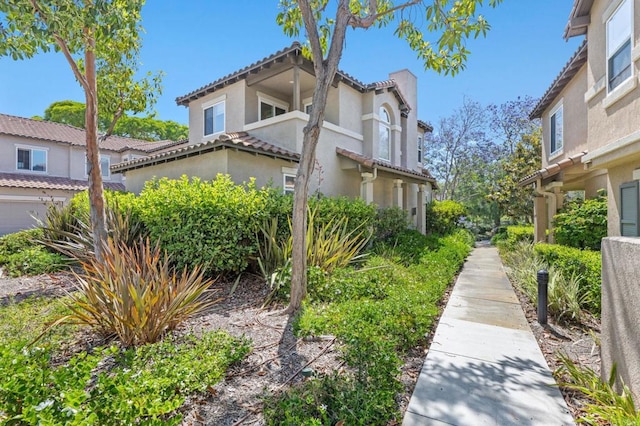 6104 Citracado Cir, Carlsbad, CA 92009 - view of side of home featuring stucco siding and a tile roof