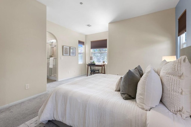 6104 Citracado Cir, Carlsbad, CA 92009 - carpeted bedroom featuring baseboards and arched walkways