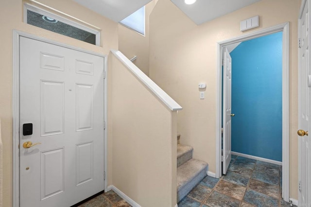 6104 Citracado Cir, Carlsbad, CA 92009 - foyer entrance featuring dark stone finish floors and stairs