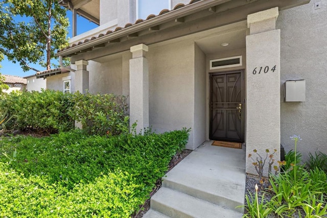 6104 Citracado Cir, Carlsbad, CA 92009 - property entrance featuring stucco siding