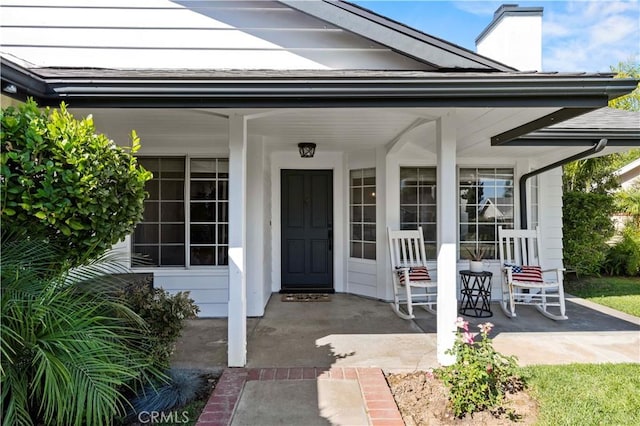 27724 Crookshank Dr, Saugus, CA 91350 - view of exterior entry with covered porch and a chimney
