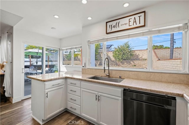 27724 Crookshank Dr, Saugus, CA 91350 - kitchen featuring dishwashing machine, wood finished floors, white cabinets, recessed lighting, and a peninsula
