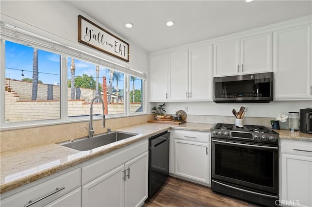 27724 Crookshank Dr, Saugus, CA 91350 - kitchen featuring stainless steel appliances, white cabinets, recessed lighting, dark wood-style flooring, and light stone counters