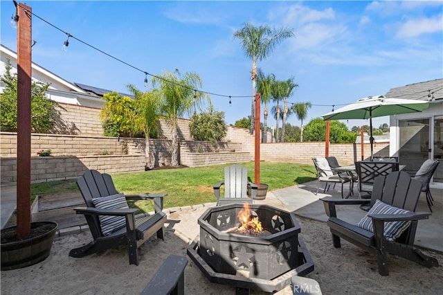 27724 Crookshank Dr, Saugus, CA 91350 - fenced backyard with a fire pit, a patio area, and outdoor dining space