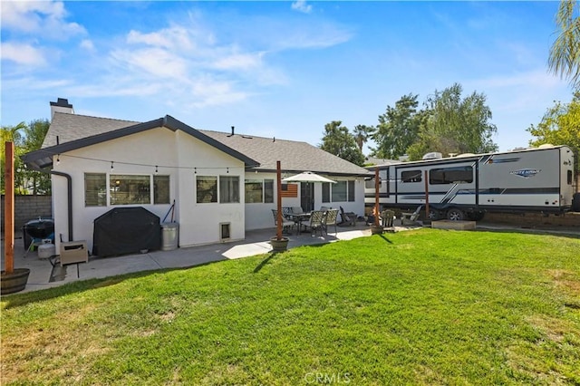27724 Crookshank Dr, Saugus, CA 91350 - back of house featuring a patio area, stucco siding, and a chimney