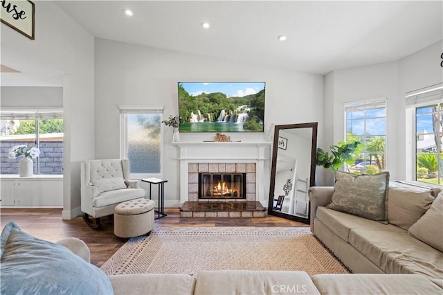 27724 Crookshank Dr, Saugus, CA 91350 - living room with wood finished floors, a fireplace, vaulted ceiling, and recessed lighting