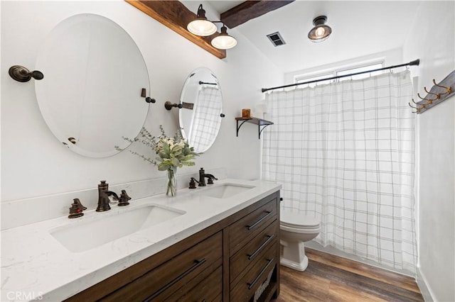 27724 Crookshank Dr, Saugus, CA 91350 - full bath with double vanity, wood finished floors, a shower with curtain, and beamed ceiling
