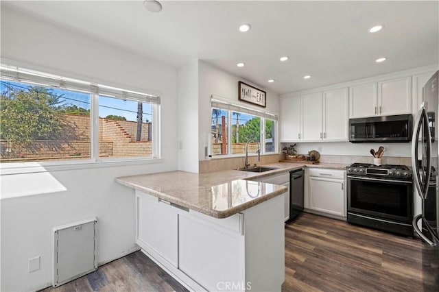 27724 Crookshank Dr, Saugus, CA 91350 - kitchen featuring black appliances, plenty of natural light, a peninsula, white cabinetry, and recessed lighting